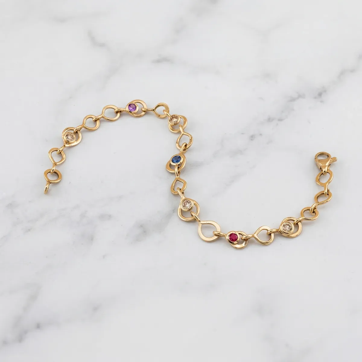 Armkette · Brillanten, Saphire & Rubin · 585 Gelbgold